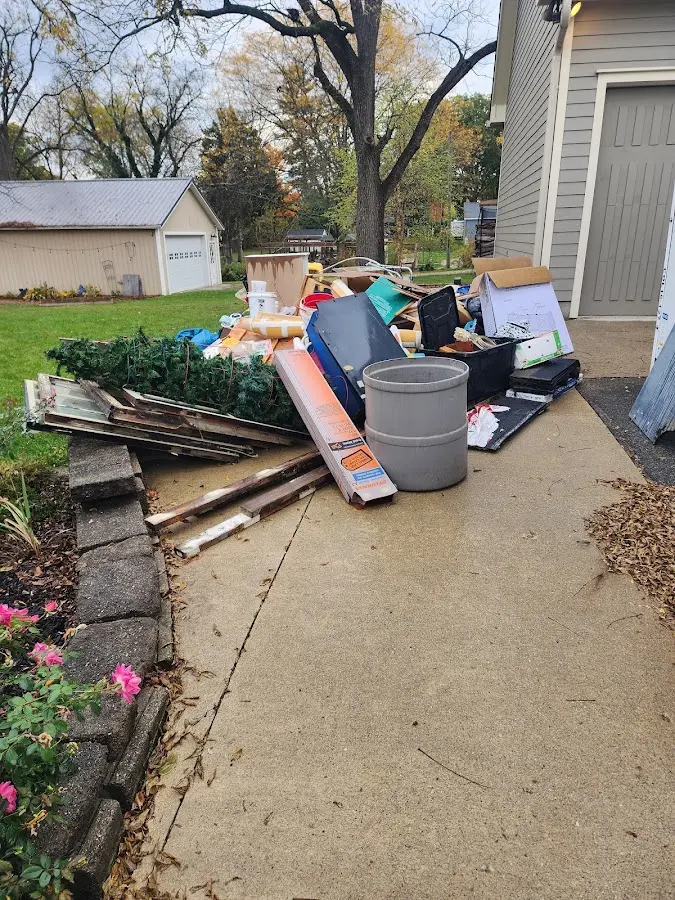 Dumpster being loaded with debris for Commercial Dumpster Rental in Wailua Homesteads